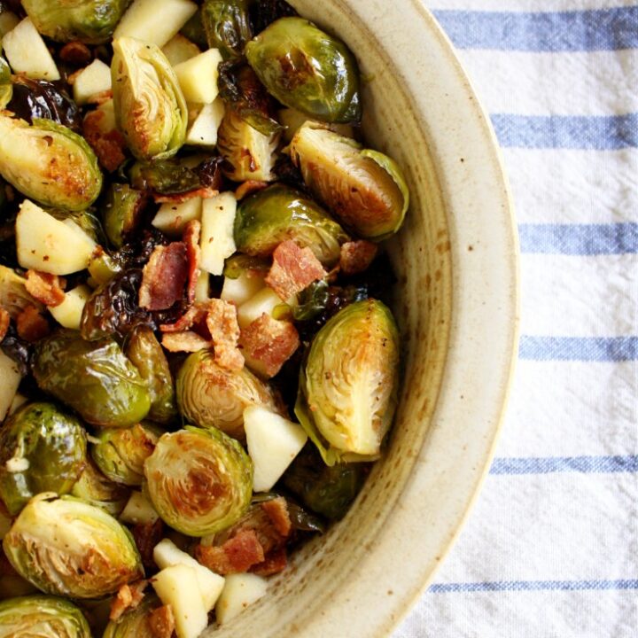 This is the perfect Thanksgiving side dish! Roasted Brussels Sprouts with Bacon and Apples is the perfect mix of savory and sweet- it's so easy to make and perfect for a crowd!