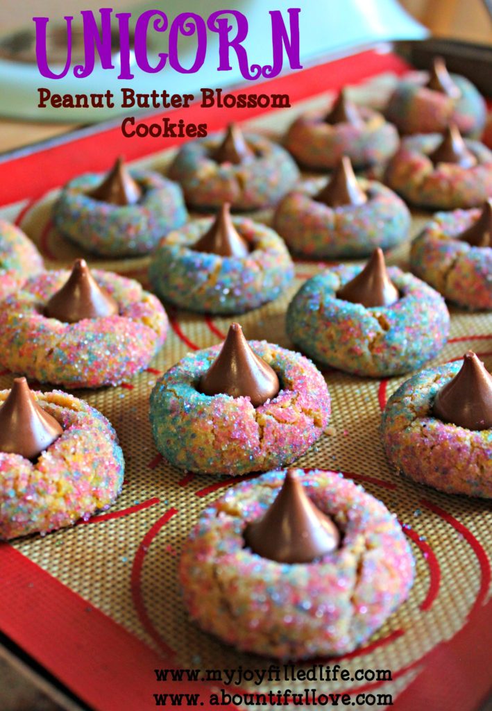 These unicorn peanut butter blossom cookies are not only easy to make, but they are sure to be a favorite at your next unicorn-themed party. #unicorn #cookies #cookierecipe #unicornparty