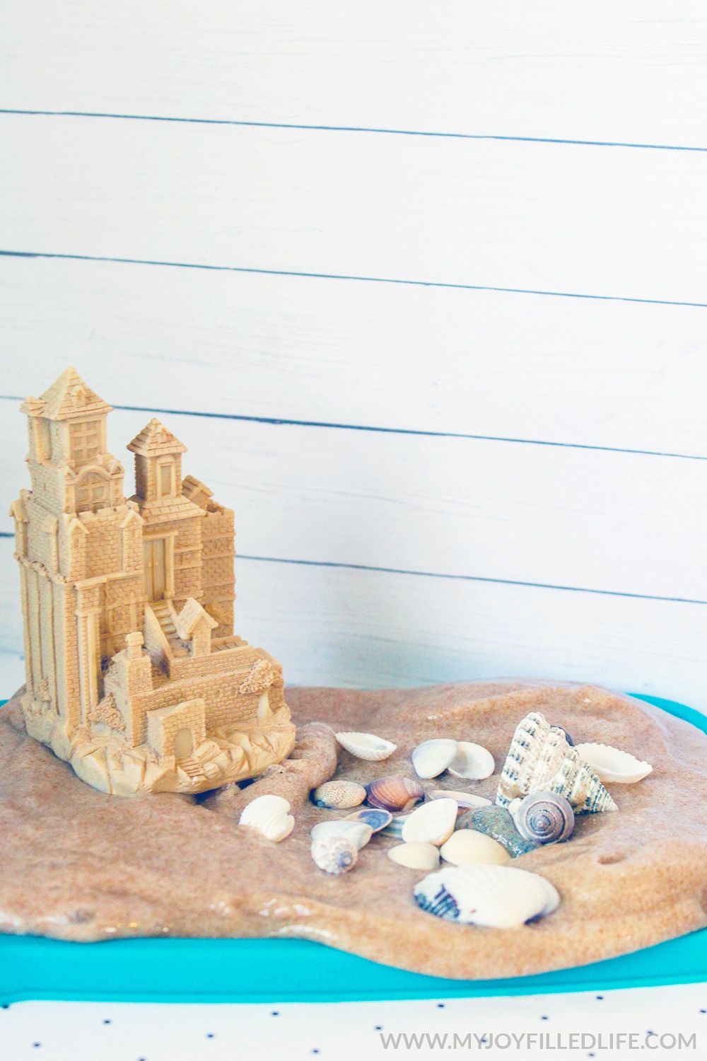 This textured sand slime activity is an absolute must try! If you have kids that love ocean or beach themed projects - they are going to love this one. #sensoryplay #slime #slimerecipe #sandslime