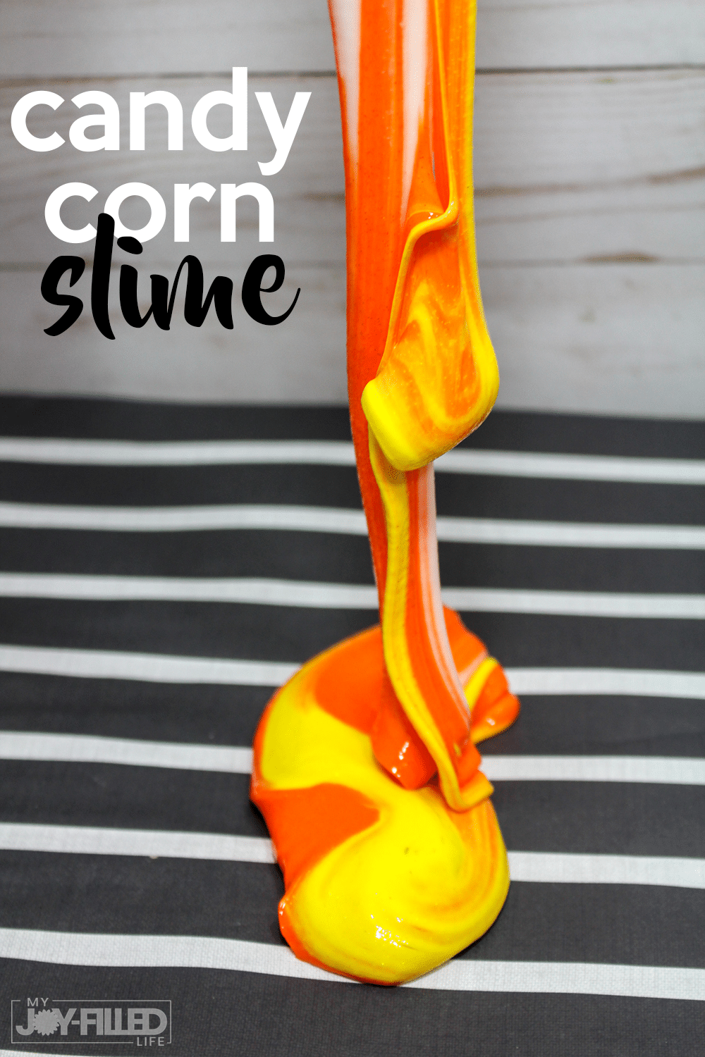 This candy corn slime is the PERFECT slime recipe for fall! It's such a fun diy slime and the kids are sure to have fun playing with this slime recipe! #slime #candycorn