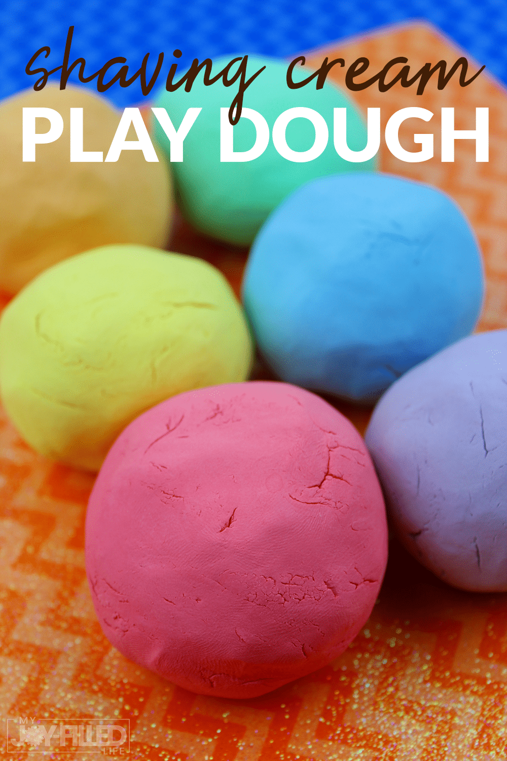 This shaving cream playdough is one of our favorite homemade playdough recipes! Kids will have SOOOOO much fun helping with this fun playdough activity. #sensoryplay #playdough #homemadeplaydough