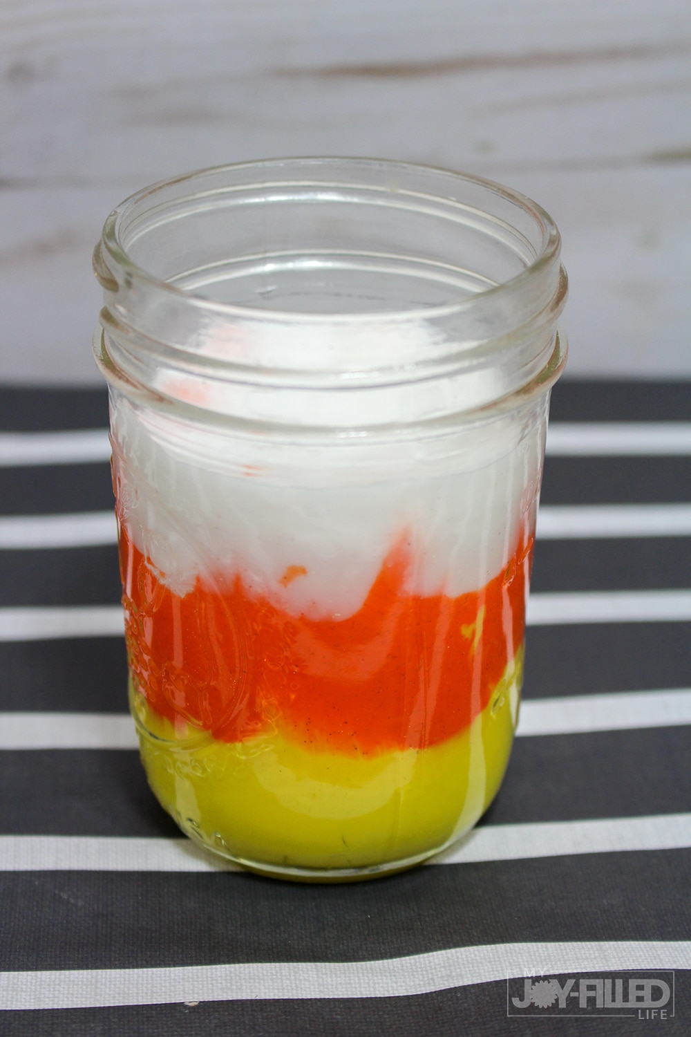 This candy corn slime is the PERFECT slime recipe for fall! It's such a fun diy slime and the kids are sure to have so much fun playing with this one. This is a slime recipe with contact solution so it is sure to make the PERFECT slime to play!