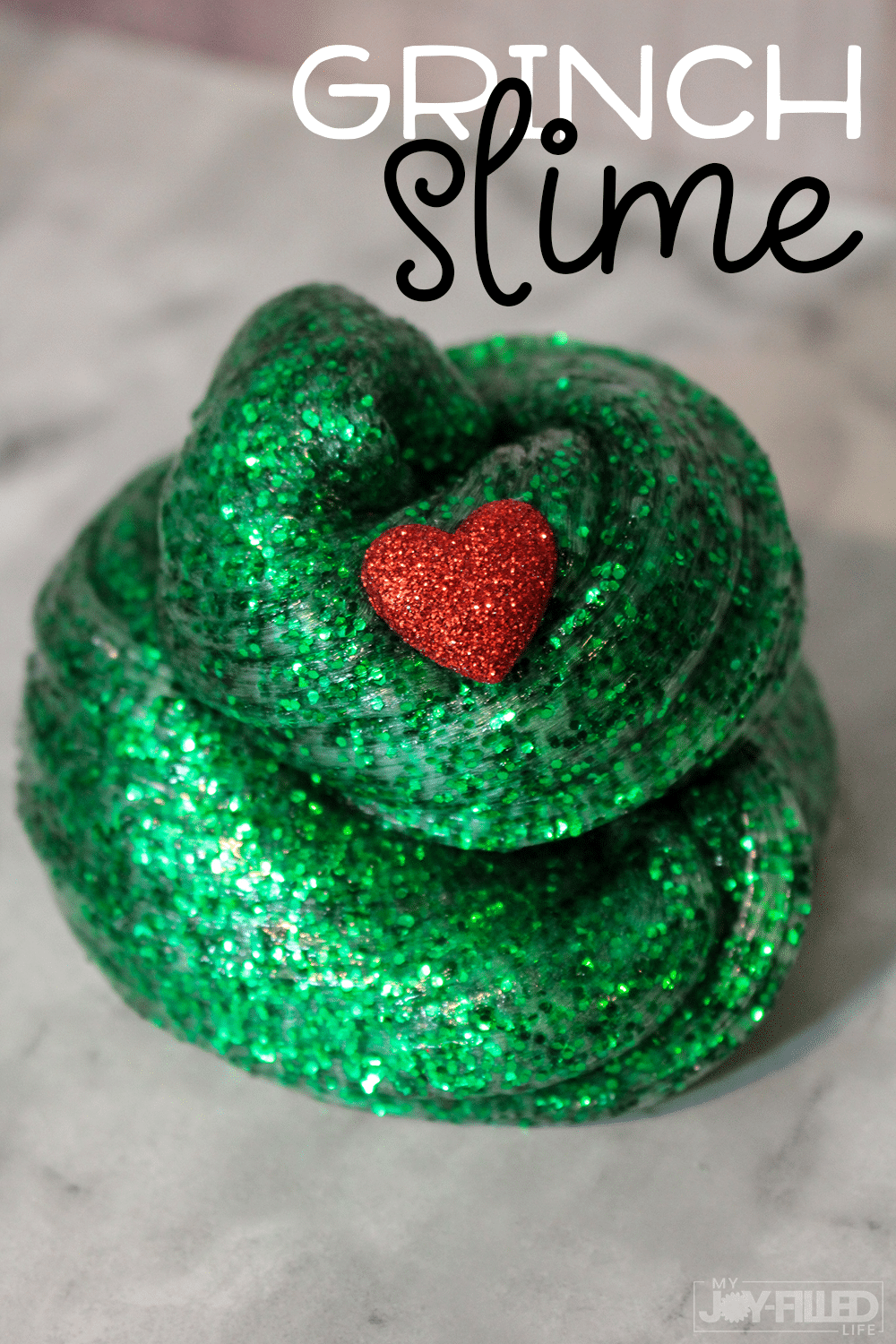 Kids will have a BLAST with this Grinch slime. It's the perfect slime recipe and super easy to make! #slime #thegrinch #grinch #grinchslime #christmas