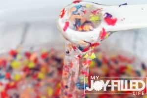mixing together the ingredients for crayon slime
