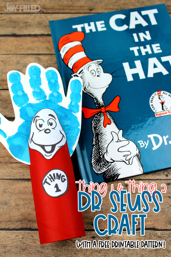 The Cat in the Hat book with a Thing 1 craft made out of a child's handprint and a toilet paper roll