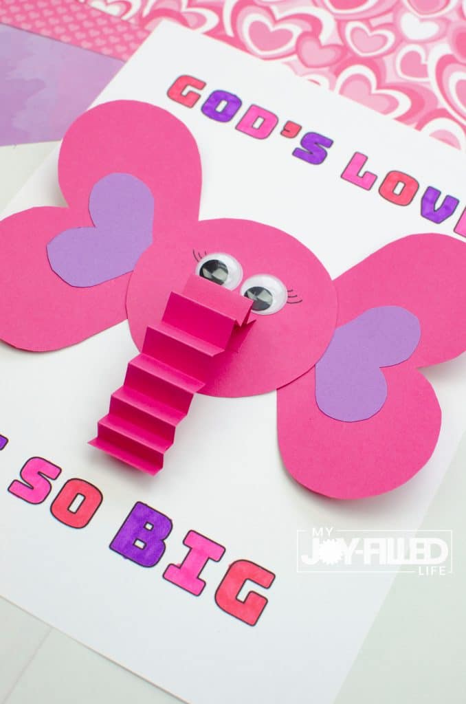 Completed God's Love is So Big Valentine craft with elephant made out of paper shapes. 