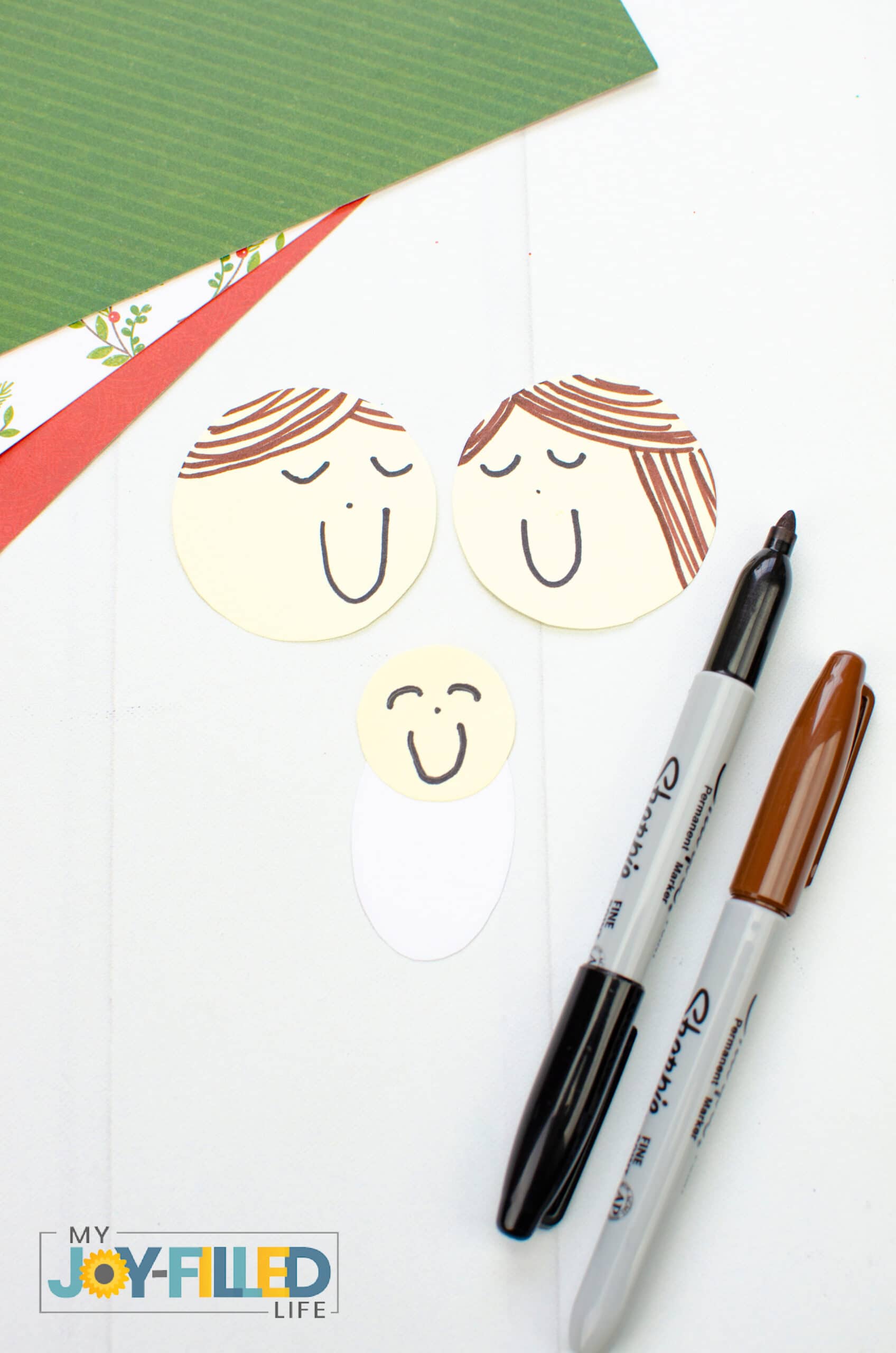 draw faces with marker for people in the nativity craft
