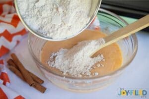 Mixing Ingredients Together for Fluffy Pumpkin Pancakes copy