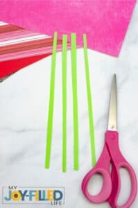 Cutting four green strips