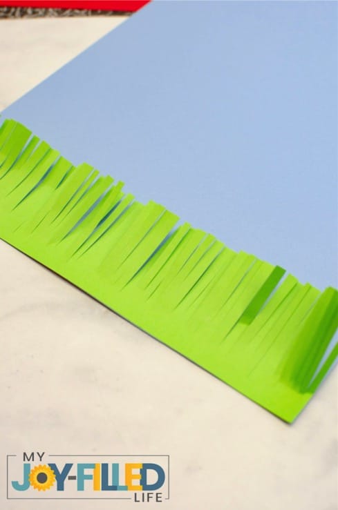 Gluing Grass to Blue Paper