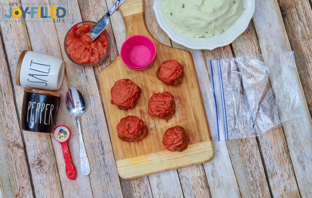 spreading topping on muffins