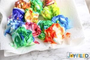 Letting Shaving Cream Easter Eggs Dry on Paper Towel
