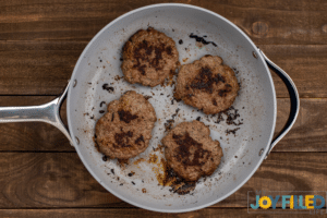 cooking up burgers on the skillet