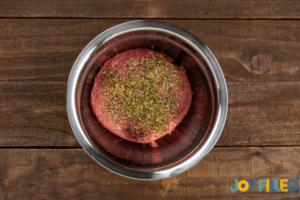 mixing the ingredients to make the burgers