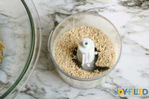 pulsing the oatmeal in the food processor