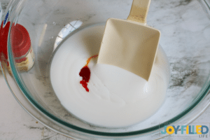 adding glue to the bowl