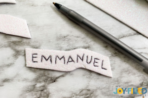 writing the word emmanuel on felt