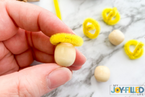gluing the wooden bead