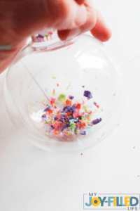 adding the crayons to the ornament