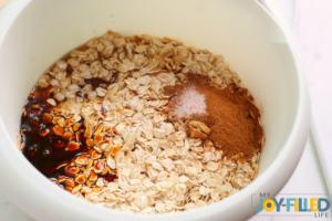 mixing ingredeints for gingerbread granola