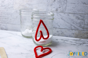 hanging the hearts in a jar