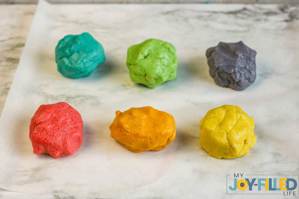 adding the food coloring to the cookie dough 